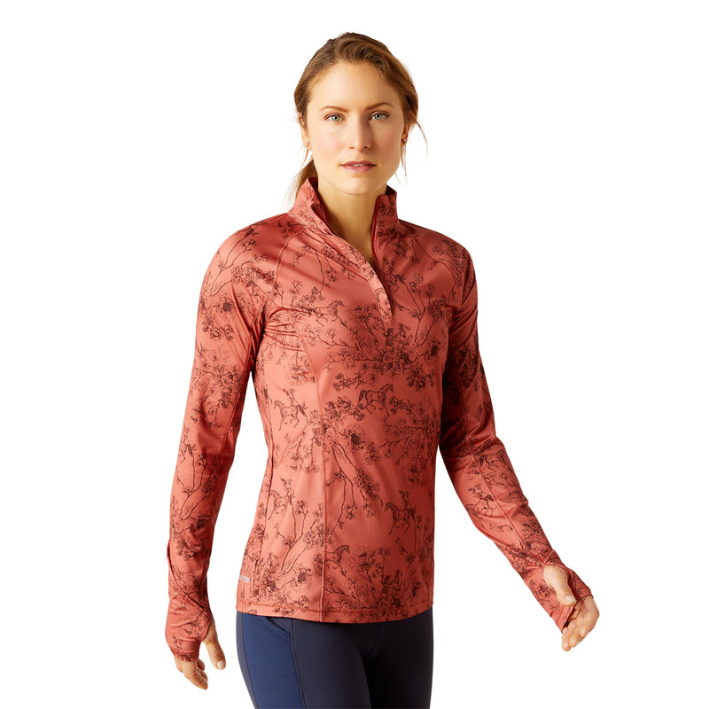 An image of a female model wearing the Ariat Lowell 1/4 Zip Baselayer in the colour Toile..