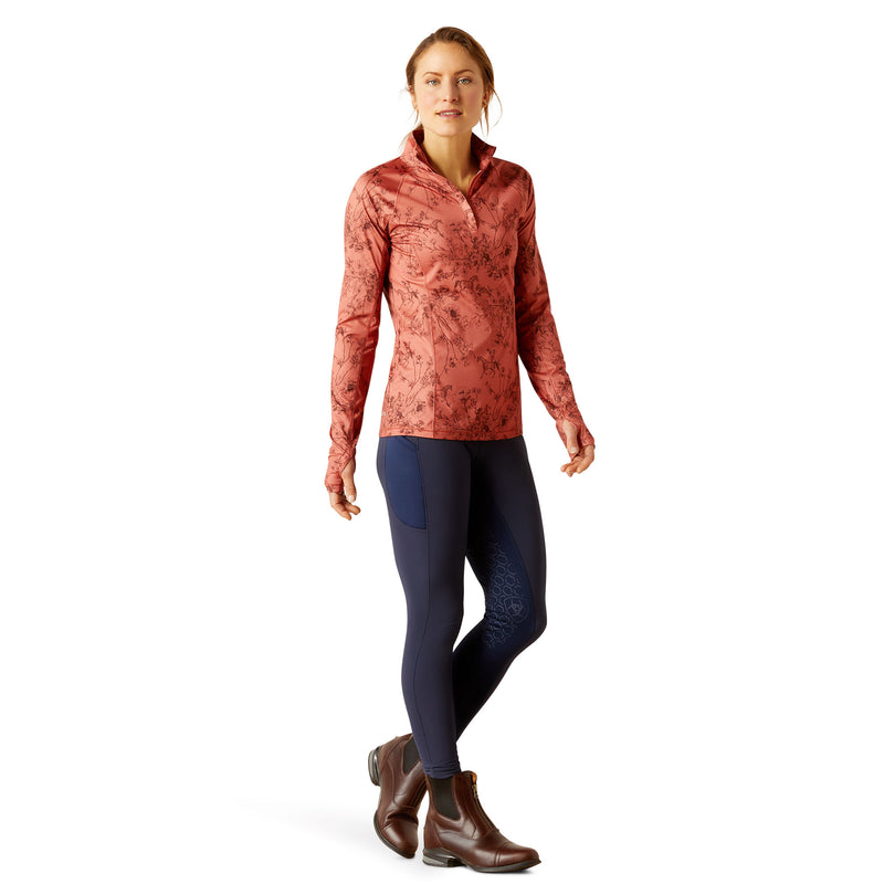 An image of a female model wearing the Ariat Lowell 1/4 Zip Baselayer in the colour Toile..