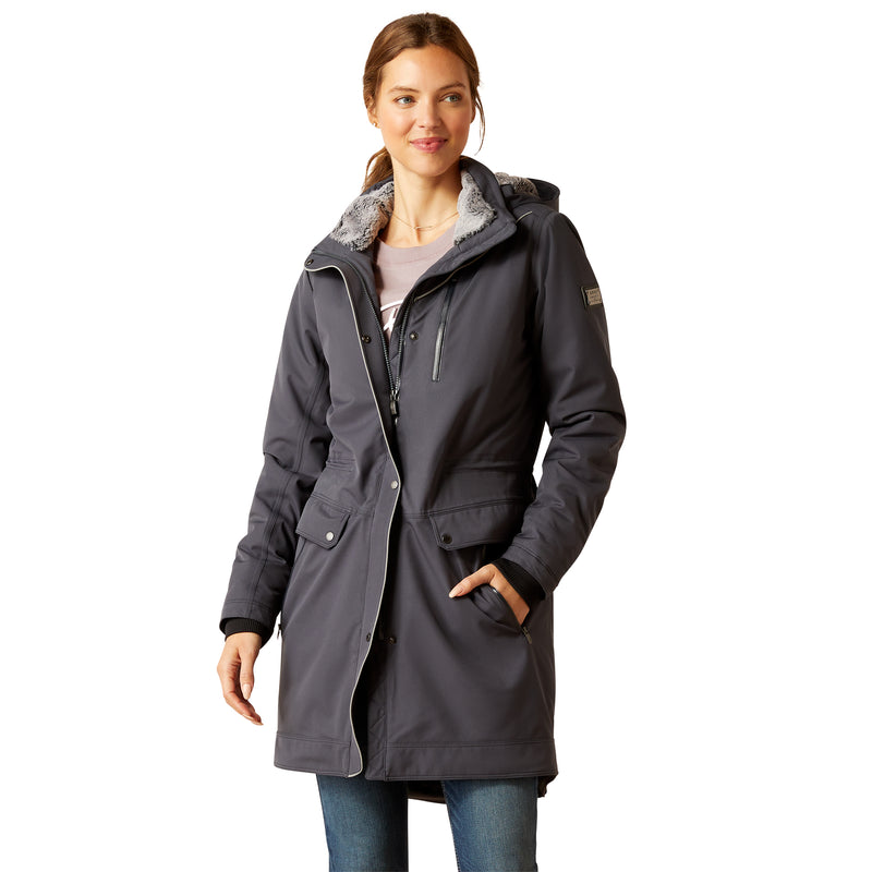 An image of a female model wearing the Ariat Tempest Waterproof Insulated Parka in the colour Ebony.