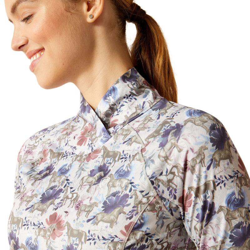 An image of a female model wearing the Ariat Lowell Wrap Baselayer in the colour Equine Floral.