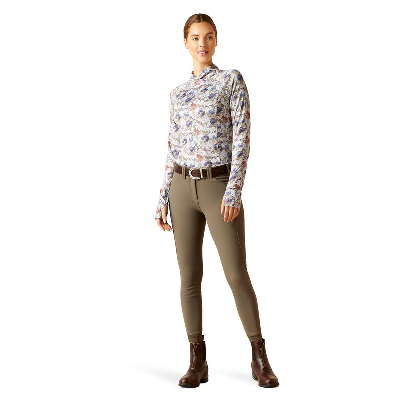 An image of a female model wearing the Ariat Lowell Wrap Baselayer in the colour Equine Floral.