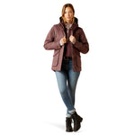 An image of a female model wearing the Ariat Sterling Waterproof Insulated Parka in the colour Raisin Pink.