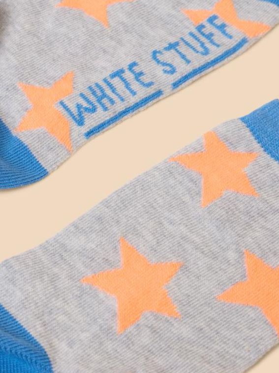 White Stuff Star Socks. Organic cotton mix ankle socks with blue hem, toe and heel, and bright orange stars on a grey background.