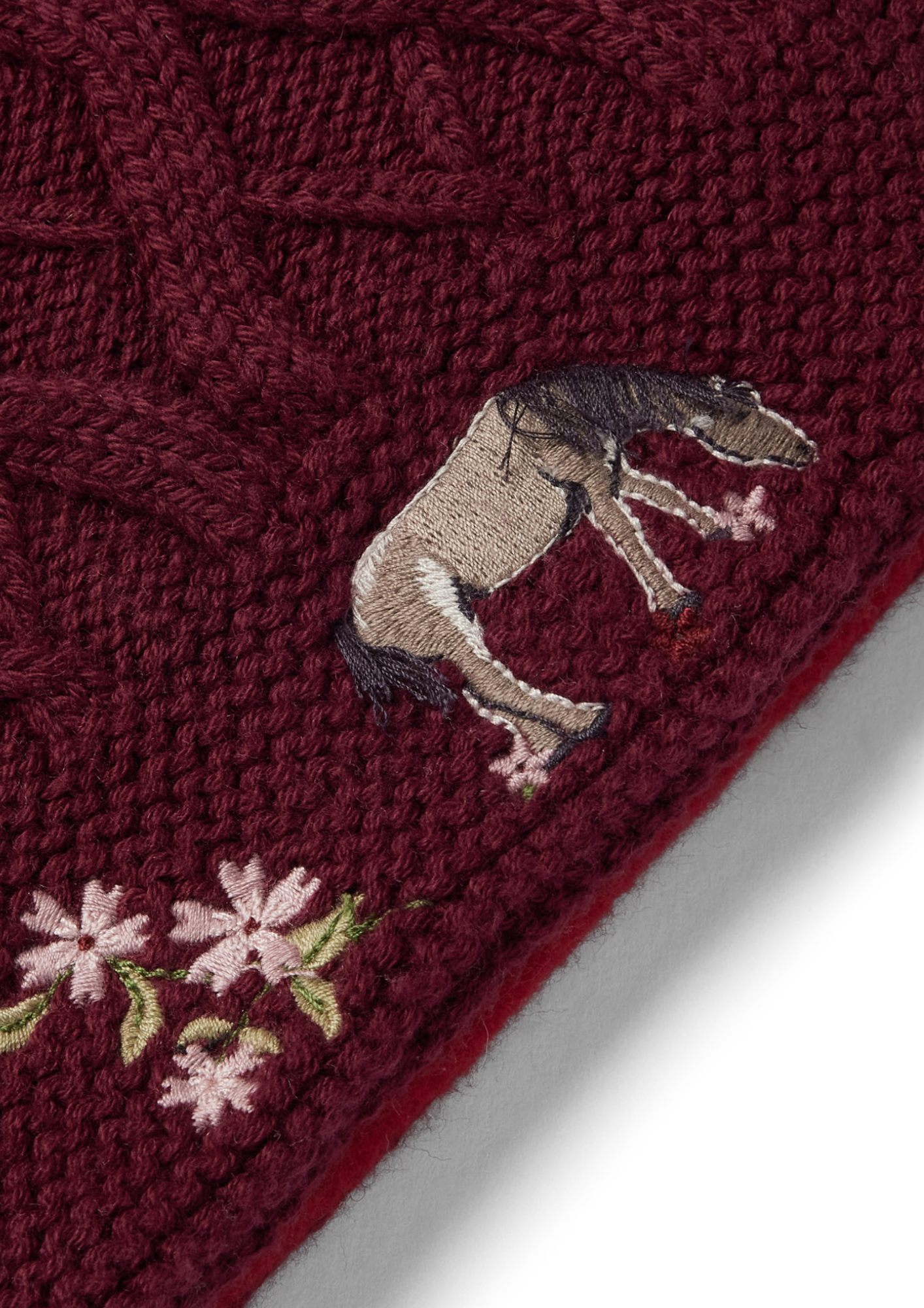 An image of the Eleanor Charles Horseshoe Floral Snood