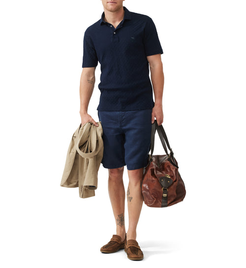 Rodd & Gunn Huntsbury Short Sleeve Shirt. An original fit short sleeve polo with collared neckline and mother of pearl buttons. This shirt comes in a stretchy navy fabric.