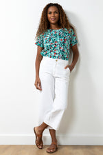 Lily & Me Isla Crop Trouser Twill. A crop fit, wide leg trouser with pockets, made from stretch fabric in a white colour.