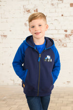 Lighthouse Jackson Full Zip Hoodie. A boys zip-up hoodie with waist pockets, a soft jersey lined hood, and a a navy torso with a tractor piqué on the chest and blue sleeves.
