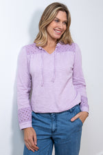 Lily & Me Spring Berkeley Top. A long sleeve, relaxed-fit top with V-neckline, neck ties and lace detail. This top is a lavender purple colour.