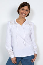 Lily & Me Spring Berkeley Top. A long sleeve, relaxed-fit top with V-neckline, neck ties and lace detail. This top is white in colour.