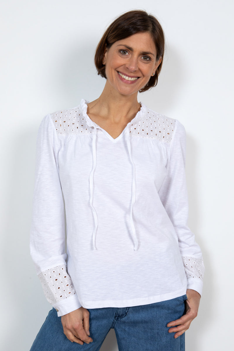 Lily & Me Spring Berkeley Top. A long sleeve, relaxed-fit top with V-neckline, neck ties and lace detail. This top is white in colour.