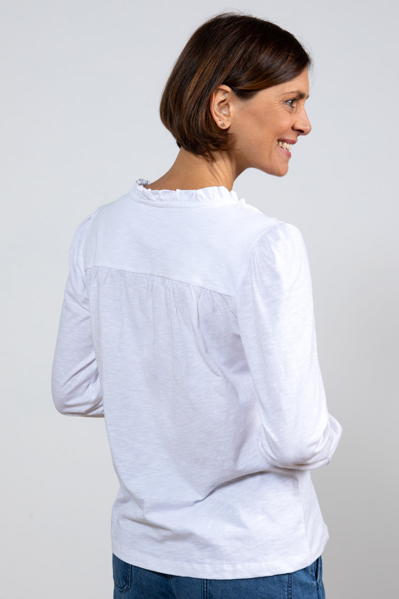 Lily & Me Spring Berkeley Top. A long sleeve, relaxed-fit top with V-neckline, neck ties and lace detail. This top is white in colour.