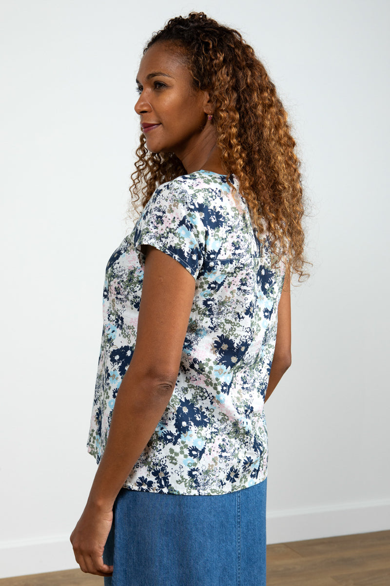 Lily & Me Sun Shade Top Meadow Spray. A semi-relaxed fit top with capped sleeves and round neckline in a multicoloured floral print.