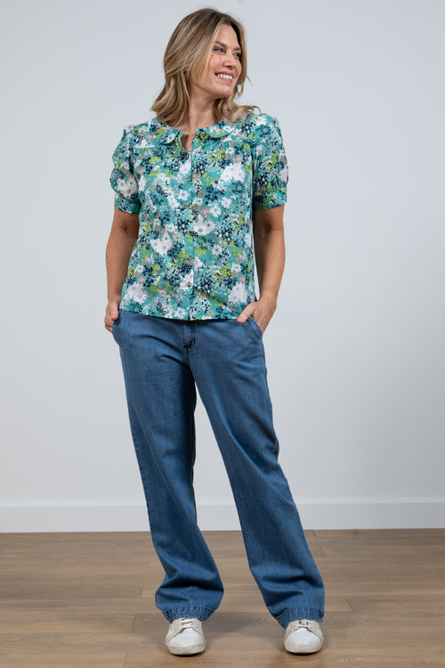 Lily & Me Lily Top Meadow Spray. A semi-relaxed fit top with capped sleeves and round neckline in a sea green floral print.
