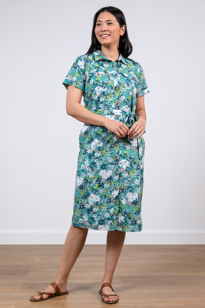 Lily & Me Dune Dress Meadow Spray. A mid-length dress with short sleeves, collared neckline and waist tie. This dress is in a sage green floral print.