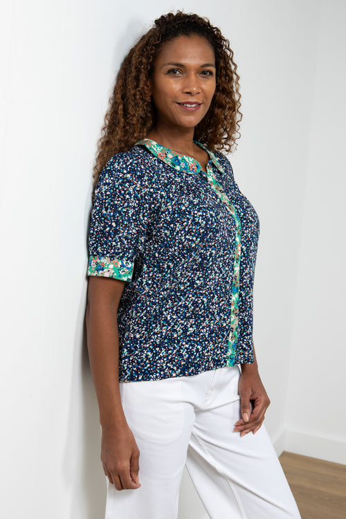 Lily & Me Lucille Top Wildflower & Terrazzo. A short sleeve top with peter pan collar and button placket. This top features contrasting prints in navy and mutlicolour.