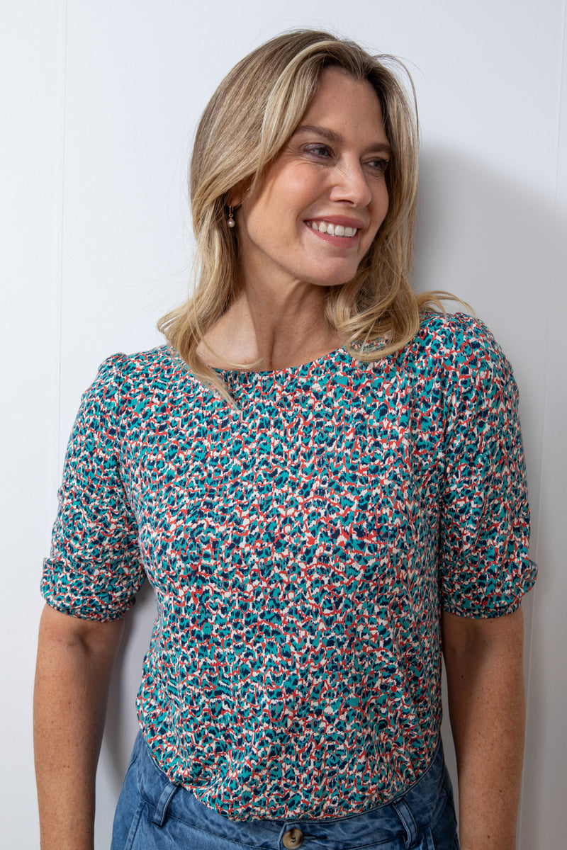 Lily & Me Meadow Animal Top. A round neck top with elbow length gathered sleeves and red animal print.