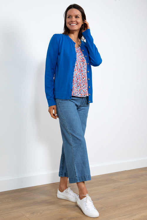 Lily & Me Camellia Cardi. A long sleeve, round neck cardigan with button closure, in cobalt blue.