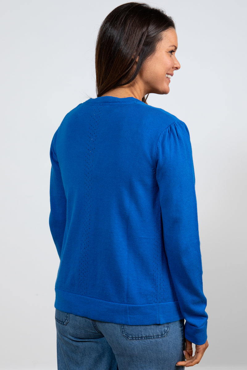 Lily & Me Camellia Cardi. A long sleeve, round neck cardigan with button closure, in cobalt blue.