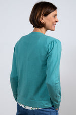 Lily & Me Camellia Cardi. A long sleeve, round neck cardigan with button closure, in sea green.