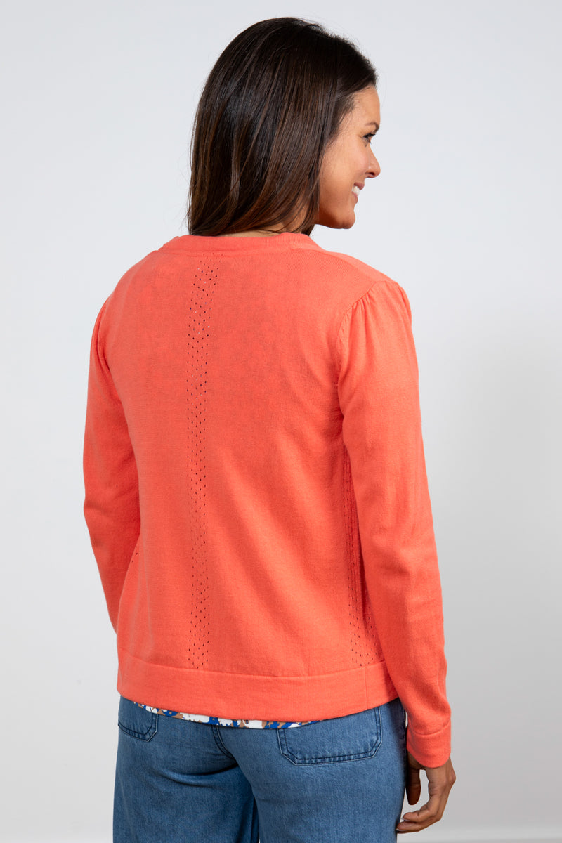 Lily & Me Camellia Cardi. A long sleeve, round neck cardigan with button closure, in sunset orange.