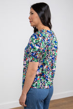 Lily & Me Frieda Lily Top. A peter pan collared top with short cuffed sleeves in a bold cobalt blue print.