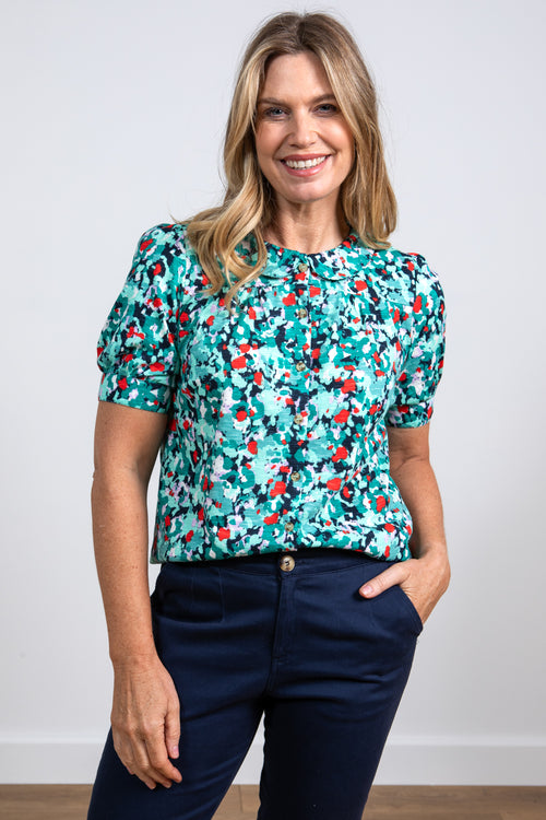 Lily & Me Frieda Lily Top. A peter pan collared top with short cuffed sleeves in a bold sea green print.