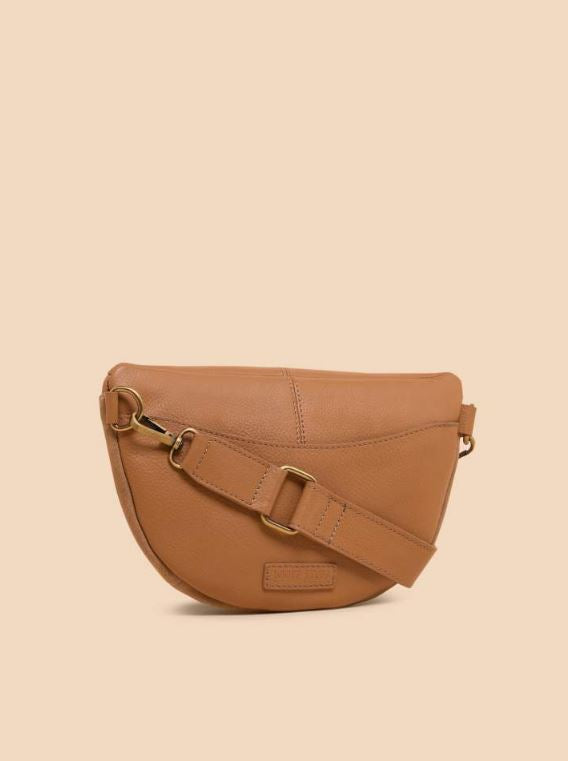 White Stuff Sebby Mini Sling Bag. A small crossbody bag in brown with zip closure, and stylish stud detailing around the zip opening.