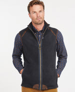 An image of a male model wearing the Barbour Langdale Fleece Gilet in the colour Navy.