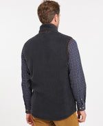 An image of a male model wearing the Barbour Langdale Fleece Gilet in the colour Navy.