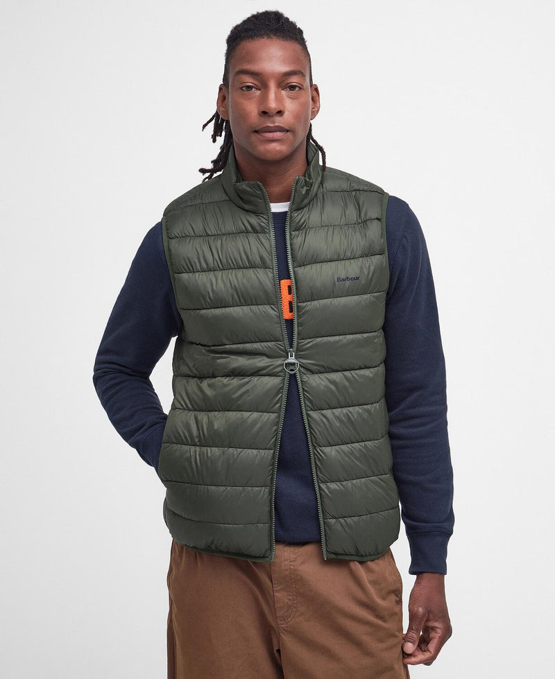 An image of a male model wearing the Barbour Men's Bretby Gilet in the colour Olive.