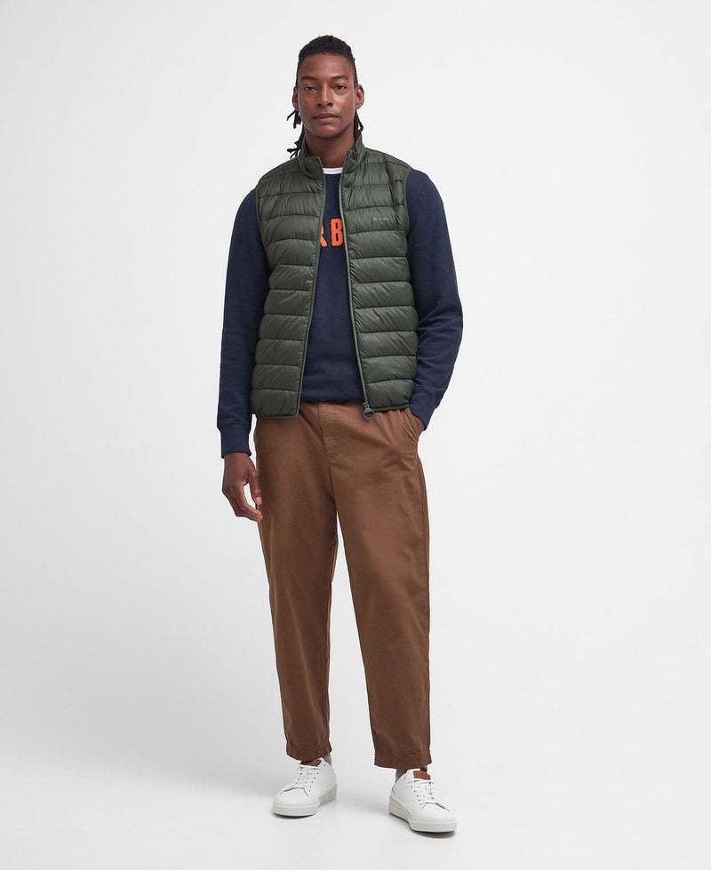 An image of a male model wearing the Barbour Men's Bretby Gilet in the colour Olive.
