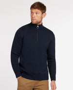 An image of a male model wearing the Barbour Cotton Half Zip Jumper in the colour Navy.