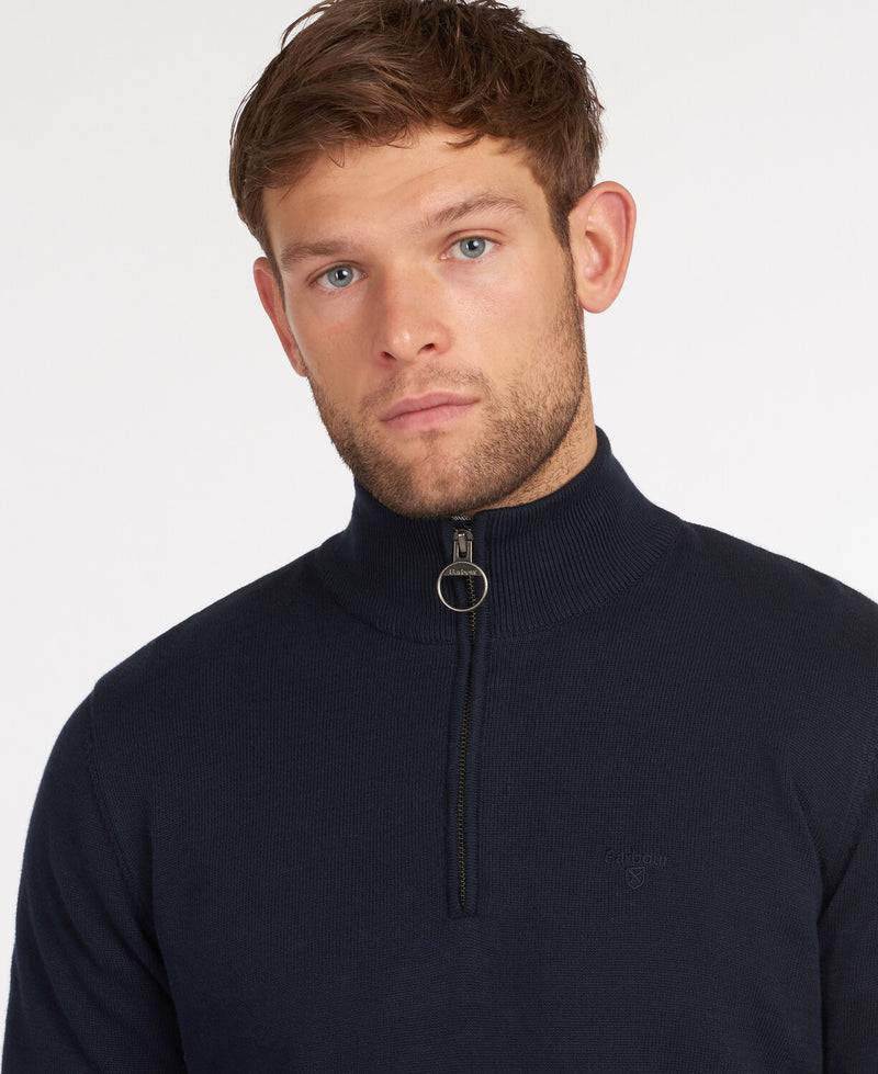 An image of a male model wearing the Barbour Cotton Half Zip Jumper in the colour Navy.