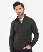 An image of a male model wearing the Barbour Firle Half Zip Sweatshirt in the colour Olive Marl.