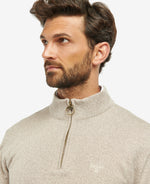 An image of a male model wearing the Barbour Firle Half Zip Sweatshirt in the colour Stone Marl.