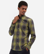 An image of a male model wearing the Barbour Kippford Tailored Long-Sleeved Shirt in the colour Classic Tartan.