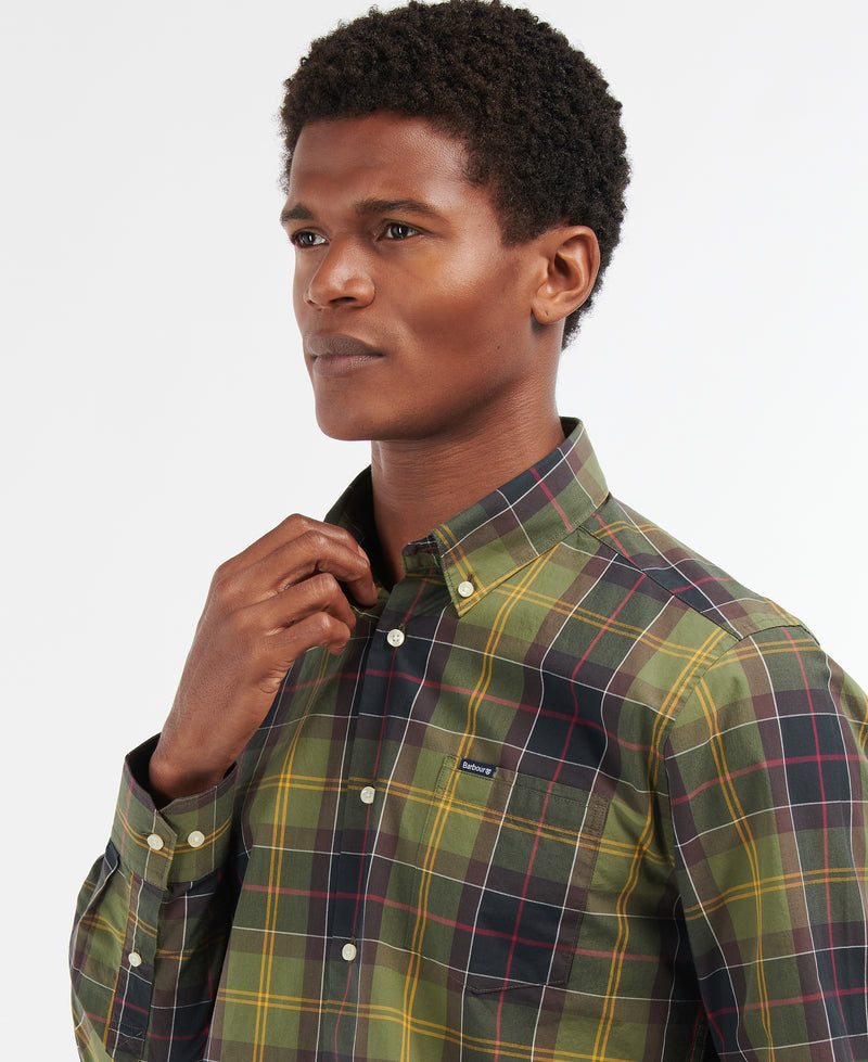 An image of a male model wearing the Barbour Kippford Tailored Long-Sleeved Shirt in the colour Classic Tartan.