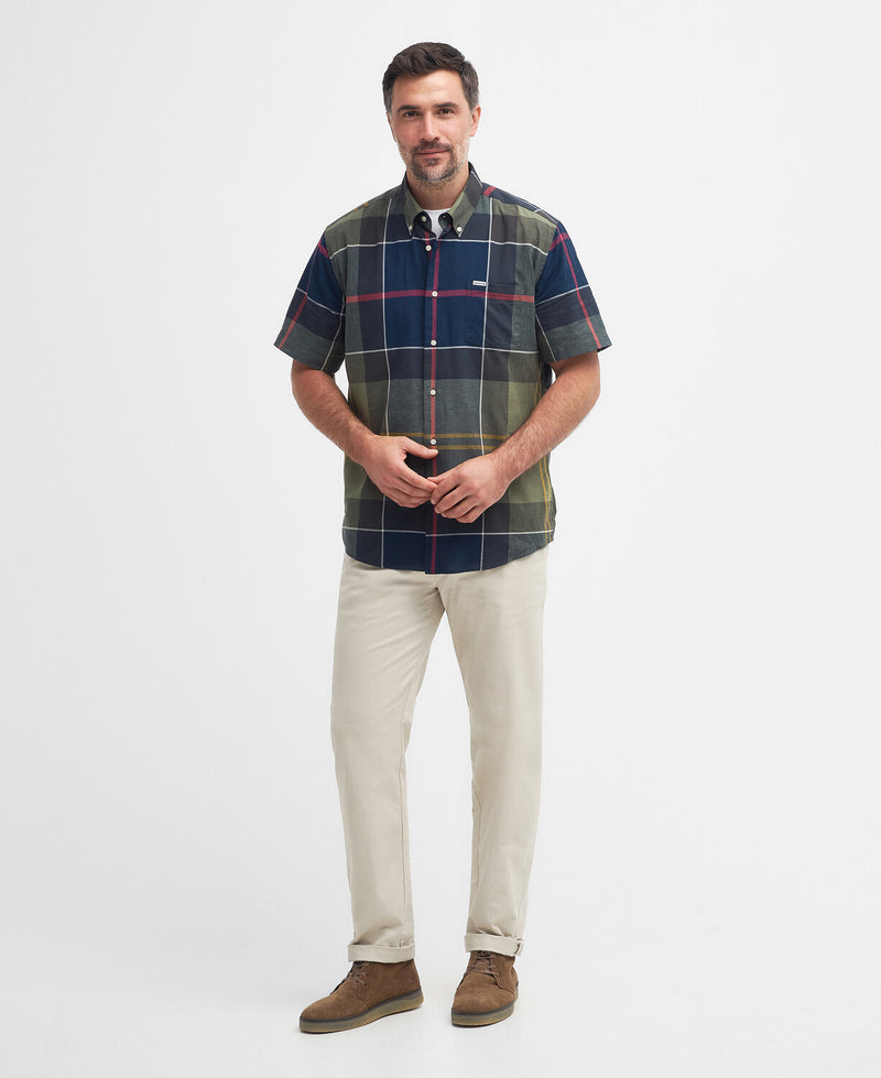 An image of a male model wearing the Barbour Douglas Regular Short-Sleeved Shirt in the colour Classic Tartan.