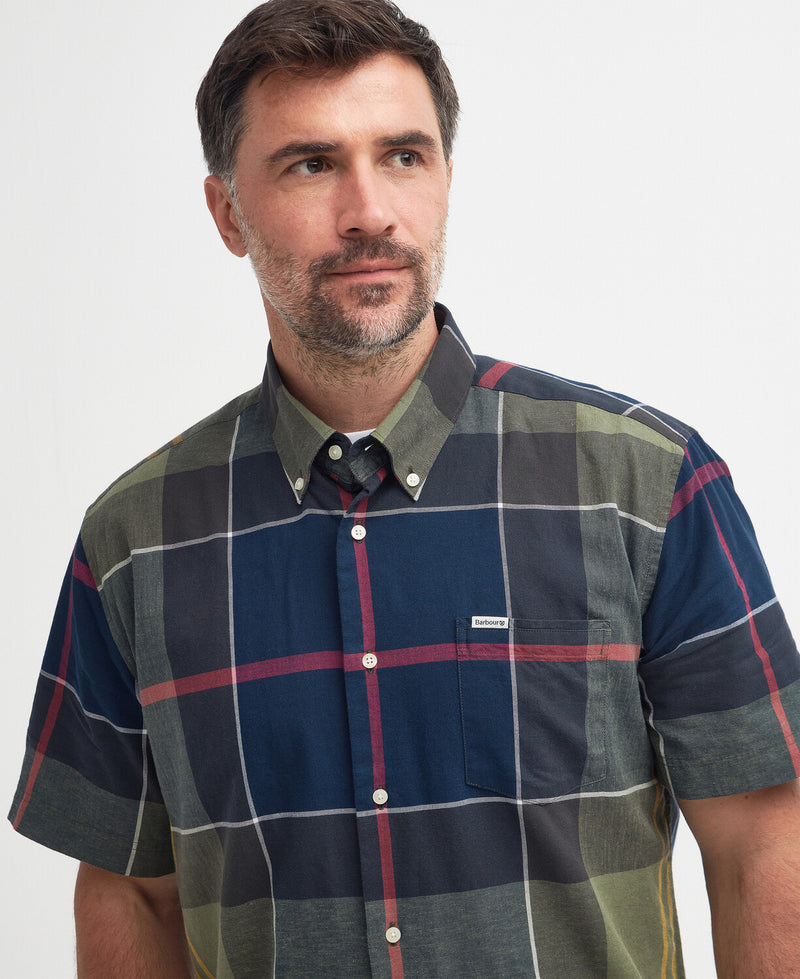 An image of a male model wearing the Barbour Douglas Regular Short-Sleeved Shirt in the colour Classic Tartan.