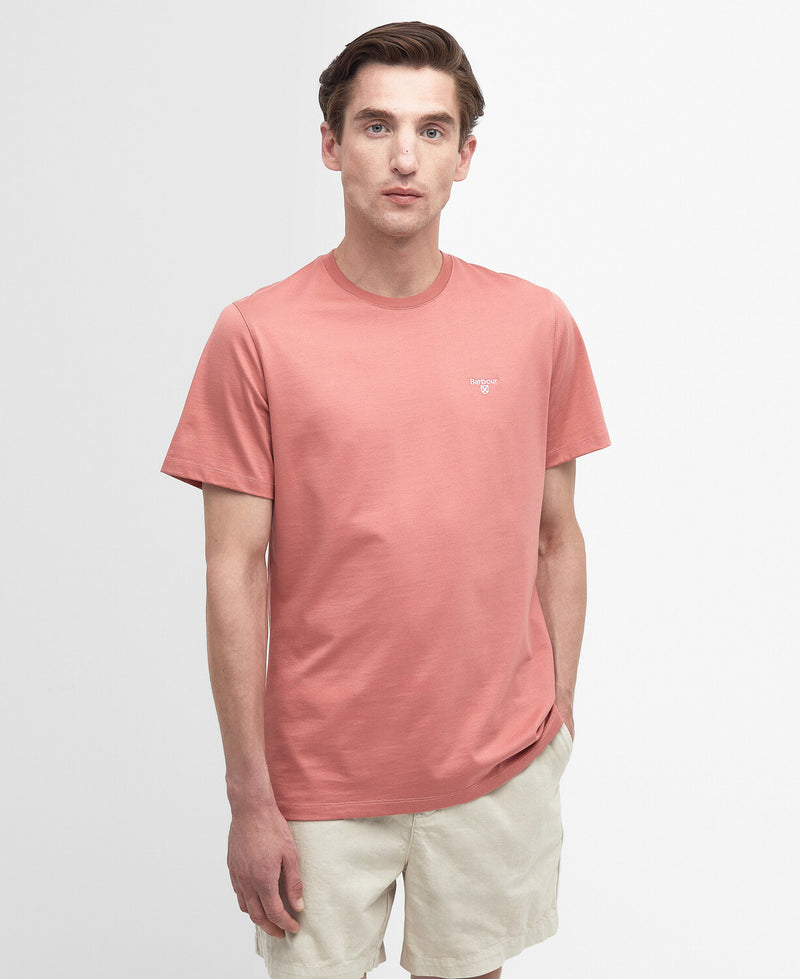 An image of a male model wearing the Barbour Men's Essential Sports T-Shirt in the colour Pink Clay.