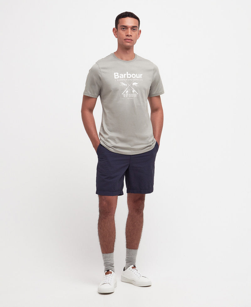 An image of a male model wearing the Barbour Fly Graphic T-Shirt in the colour Forest Fog.