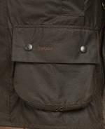 An image of the Barbour Classic Beaufort Wax Jacket in the colour Olive.