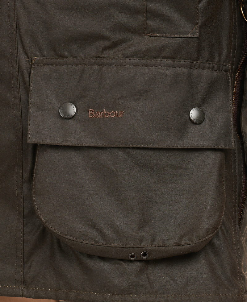 An image of the Barbour Classic Beaufort Wax Jacket in the colour Olive.