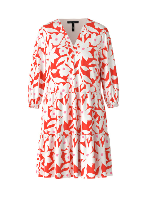 Marc Cain 3/4 Sleeve Tiered Dress. A midi length dress with 3/4 length sleeves, V-neckline, tiered skirt, and red floral print. In the colour Tomato.