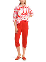 Marc Cain Flamingo Long Sleeve Blouse. A long sleeve blouse with Kent collar, button placket and pink flamingo print.