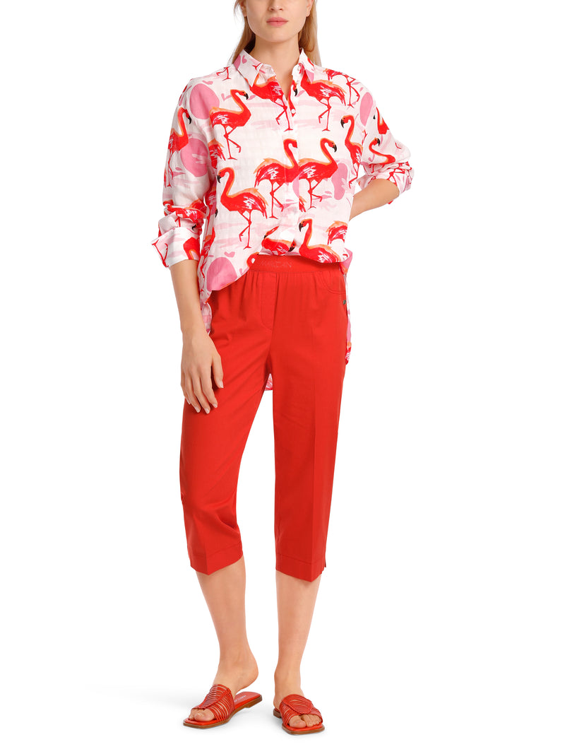 Marc Cain Flamingo Long Sleeve Blouse. A long sleeve blouse with Kent collar, button placket and pink flamingo print.