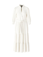 Marc Cain Tiered Maxi Dress. A maxi length dress with 3/4 length sleeves, tiered skirt and kent style collar. This dress is off-white and has a tie waist detail.