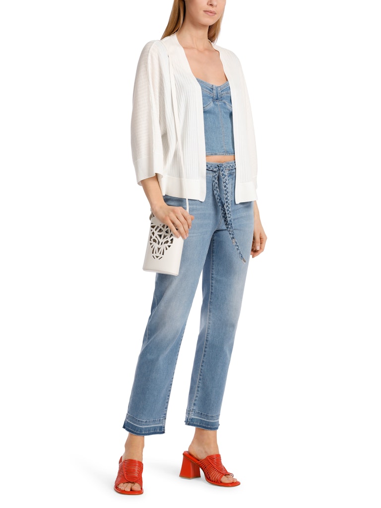 Marc Cain Cardigan. An oversized fit cardigan with 3/4 length kimono sleeves and V-neck. This cardigan is made from a soft flowing white material.