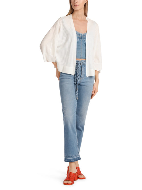 Marc Cain Cardigan. An oversized fit cardigan with 3/4 length kimono sleeves and V-neck. This cardigan is made from a soft flowing white material.