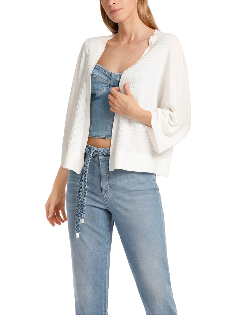 Marc Cain Cardigan. An oversized fit cardigan with 3/4 length kimono sleeves and V-neck. This cardigan is made from a soft flowing white material.